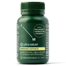 A dark green bottle of Ultra Nature Immune Defence film-coated tablets, featuring a matching green cap and a label with white and yellow text.