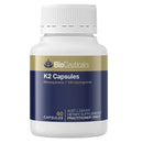 BioCeuticals K2 Capsules dietary supplement bottle with a white cap and a navy blue and gold label, containing 60 capsules.