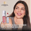 L'Oreal Paris lip product with a woman smiling, featuring the brand logo.