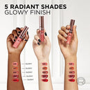 Three hands holding lipsticks with color swatches on arms against a white background
