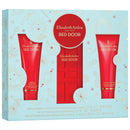 A gift set by Elizabeth Arden Red Door, containing three bottles of different products, presented in a box with a red door and decorative elements.
